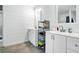 Bright bathroom features double vanity sinks, modern white cabinets and fixtures at 8262 Fairview Nursery Rd, Hollywood, SC 29449