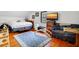 Bright bedroom with hardwood floors, seating area and natural light at 8262 Fairview Nursery Rd, Hollywood, SC 29449