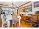 Dining room boasts wood floors, chandelier, plate collection, and wood trim at 8262 Fairview Nursery Rd, Hollywood, SC 29449