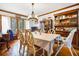 Open dining area featuring vintage wooden furnishings and natural light at 8262 Fairview Nursery Rd, Hollywood, SC 29449