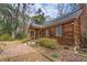 Rustic home with a brick pathway leading to the front porch, set among lush trees at 8262 Fairview Nursery Rd, Hollywood, SC 29449