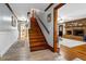 Hallway featuring hardwood floors, staircase, and views into the living room at 8262 Fairview Nursery Rd, Hollywood, SC 29449
