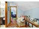 Comfortable hallway leading to living room with hardwood floors and natural light at 8262 Fairview Nursery Rd, Hollywood, SC 29449