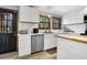 Beautiful kitchen features stainless steel appliances, wood countertop, white cabinets and backsplash at 8262 Fairview Nursery Rd, Hollywood, SC 29449