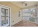 Back porch with wood flooring and view of backyard area at 8475 Athens Way, North Charleston, SC 29420