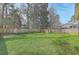 Spacious backyard with lush green grass and privacy fence at 8475 Athens Way, North Charleston, SC 29420