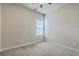 Neutral bedroom features a large window with blinds and neutral carpet at 8475 Athens Way, North Charleston, SC 29420