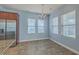 Bright dining area with natural light and tile flooring adjacent to the kitchen at 8475 Athens Way, North Charleston, SC 29420