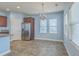 Adjacent dining area features tiled floors and a stainless steel refrigerator at 8475 Athens Way, North Charleston, SC 29420