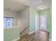 Upstairs hallway with natural light and view of the stairwell at 8475 Athens Way, North Charleston, SC 29420