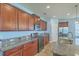 Well-lit kitchen with granite counters, ample cabinet space, and stainless appliances at 8475 Athens Way, North Charleston, SC 29420