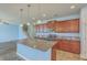 Open kitchen features a granite island, stainless appliances, and beautiful cabinets at 8475 Athens Way, North Charleston, SC 29420