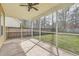 View of the screened-in porch with ceiling fan and access to backyard at 8475 Athens Way, North Charleston, SC 29420