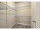 Walk-in closet with wire shelving, neutral walls, and neutral carpet at 8475 Athens Way, North Charleston, SC 29420