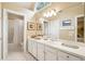 Bathroom featuring a tub/shower combo and a large mirror at 93 Surfscoter Ln, Kiawah Island, SC 29455