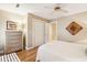 Bedroom with dresser, closet, a window, and an ensuite bathroom at 93 Surfscoter Ln, Kiawah Island, SC 29455
