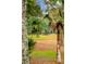 Scenic golf course view framed by lush trees and greenery, offering a tranquil and recreational setting at 93 Surfscoter Ln, Kiawah Island, SC 29455