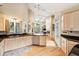 Spacious kitchen overlooking the living room with stainless steel appliances, light wood cabinets, and an island at 93 Surfscoter Ln, Kiawah Island, SC 29455