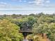 Scenic landscape view showing a serene pond surrounded by lush trees, offering a secluded and peaceful ambiance at 93 Surfscoter Ln, Kiawah Island, SC 29455