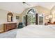 Bright main bedroom featuring large windows with beautiful views and a comfortable sitting area at 93 Surfscoter Ln, Kiawah Island, SC 29455