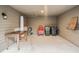 Spacious storage area featuring an outdoor shower, chairs, trash cans, and a mounted wire basket at 93 Surfscoter Ln, Kiawah Island, SC 29455