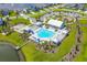 Aerial view of a community pool and amenities surrounded by beautifully landscaped grounds and residential neighborhood at 108 Whaler Ave, Summerville, SC 29486