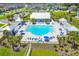 Aerial view of a luxurious community pool with cabanas, seating, and landscaped grounds, ideal for relaxation and leisure at 108 Whaler Ave, Summerville, SC 29486