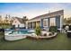 Spacious backyard with manicured lawn, blue siding house and outdoor pool at 108 Whaler Ave, Summerville, SC 29486