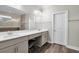 Bathroom featuring double vanity with framed mirror and wood-look tile flooring at 108 Whaler Ave, Summerville, SC 29486