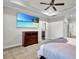 Inviting bedroom boasts ceiling fan, tray ceiling, and wall mounted TV with beach scene at 108 Whaler Ave, Summerville, SC 29486