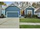 Charming blue home featuring a two-car garage, craftsman details, and well-maintained landscaping at 108 Whaler Ave, Summerville, SC 29486