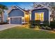 Home featuring a two-car garage, manicured lawn, and inviting entrance at 108 Whaler Ave, Summerville, SC 29486