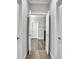Hallway with wood floors leads to a bright room, showing an open and airy design at 108 Whaler Ave, Summerville, SC 29486