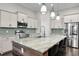 Large kitchen island featuring wood accents, a marble countertop, and modern pendant lighting at 108 Whaler Ave, Summerville, SC 29486