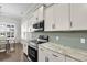 Elegant kitchen featuring stainless steel appliances and white cabinetry at 108 Whaler Ave, Summerville, SC 29486