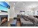 Comfortable living room with a fireplace and a glimpse into the open kitchen area at 108 Whaler Ave, Summerville, SC 29486