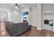 Living room with a fireplace, TV screen, and an open doorway to another room at 108 Whaler Ave, Summerville, SC 29486
