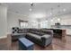 Open-concept living room showing ample seating and a view of the kitchen and dining area at 108 Whaler Ave, Summerville, SC 29486