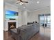 Cozy living room showcasing a fireplace, plush seating, and access to an outdoor patio at 108 Whaler Ave, Summerville, SC 29486