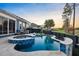 Backyard swimming pool and spa with beautiful blue tile and black fence at 108 Whaler Ave, Summerville, SC 29486