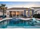 Inviting backyard pool and spa featuring cool blue tile and a sunroom with lots of natural light at 108 Whaler Ave, Summerville, SC 29486