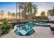 Backyard swimming pool and spa with waterfall feature and lounge chairs at 108 Whaler Ave, Summerville, SC 29486