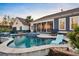Beautiful backyard pool with spa, sunroom, and comfortable seating at this home at 108 Whaler Ave, Summerville, SC 29486