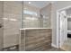 Bathroom featuring glass-enclosed shower with showerhead and wood tile surround at 108 Whaler Ave, Summerville, SC 29486