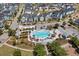 Aerial view of neighborhood pool featuring lounge chairs, pergolas, and manicured landscaping at 1107 Bellwether Ln, Summerville, SC 29485