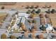 An aerial view of the property shows parking, green spaces, and a retail establishment on a sunny day at 1107 Bellwether Ln, Summerville, SC 29485