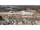 An aerial view of a large performing arts center and school complex surrounded by a neighborhood and forest at 1107 Bellwether Ln, Summerville, SC 29485