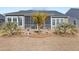Lush backyard with a screened-in porch and decorative landscaping elements and palm trees at 1107 Bellwether Ln, Summerville, SC 29485
