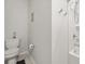 Simple bathroom with a toilet and a shower with clean white tiles and modern fixtures at 1107 Bellwether Ln, Summerville, SC 29485