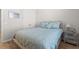 Comfortable bedroom with a rustic bed frame, a nightstand, and neutral decor at 1107 Bellwether Ln, Summerville, SC 29485